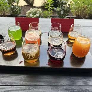 a variety of beers on a tray