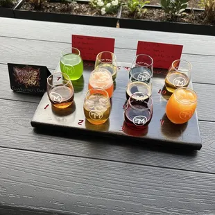 a variety of beers on a tray