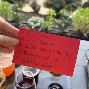 a person holding up a note