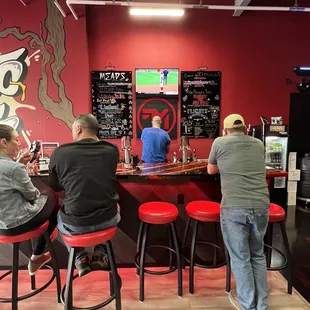 people sitting at a bar