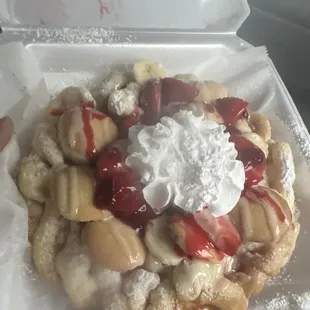 Banana pudding funnel cake with strawberries