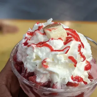a hand holding a dessert