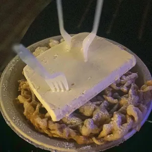 Regular funnel cake with powdered sugar and ice cream