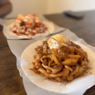 Delicious funnel cakes! (Peach cobbler and strawberry cheesecake)