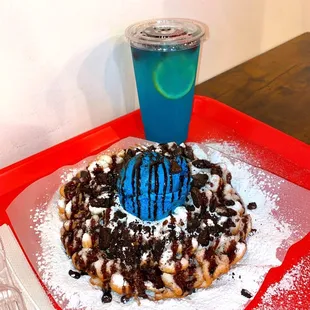 a funnel cake on a red tray