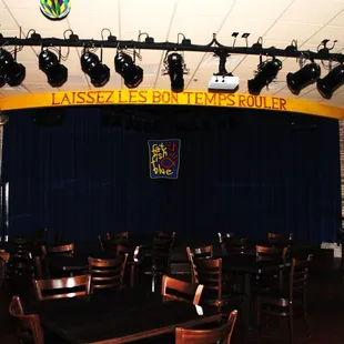 a stage with a blue curtain