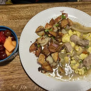 Chile verde scramble, country potatoes, and a side of fruit.