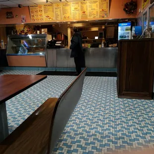 Counter at funny greek. We normally get mini gyro, salad, lemon chicken orzo soup or fried.