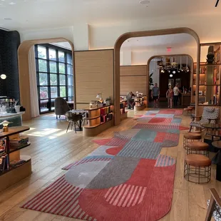 a colorful rug in the middle of the room