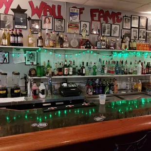 a bar with green lights