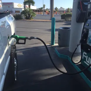 a gas pump being filled with gas
