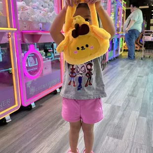 My daughter showing off some of her prizes