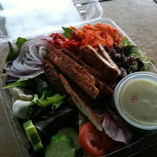 a salad in a plastic container