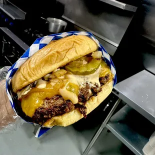 The Jack Tripper burger - Grilled onions, pickles, cheddar, special sauce.