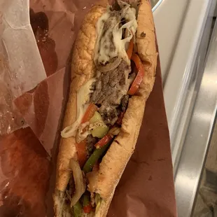 a sandwich with meat and vegetables