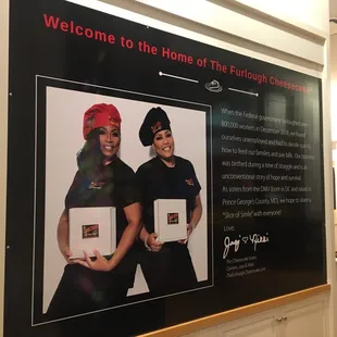 a woman and a man in front of a sign that says welcome to the home of the furlough
