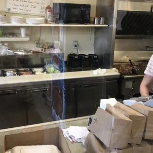 a woman working in a kitchen