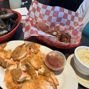 L-R Basket of steam mussels, basket of steam shrimp 1/2 lbs, crab balls and cream of crab soup.