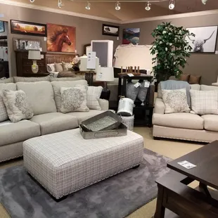 White sofa and loveseat shown with matching ottoman.
