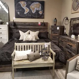 Dark industrial bedroom set. Shown with headlight headboard.