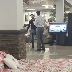 The store manager not wearing a mask, despite signs up all over the door stating masks are requiref.