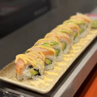 a long rectangular platter of sushi