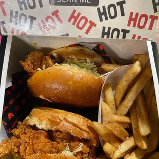 a hot dog and french fries in a box