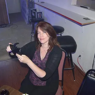 a woman holding a camera
