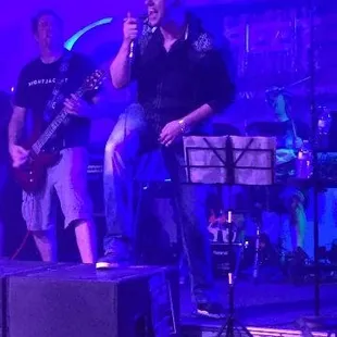 a man singing on stage