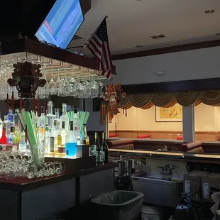 a bar with a television on the wall