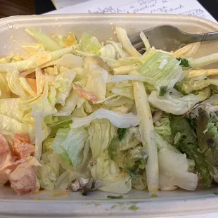 Watery and bland bed of lettuce with very brown/gray avocado.