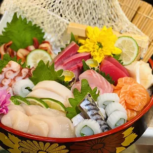 a close up of a bowl of sushi