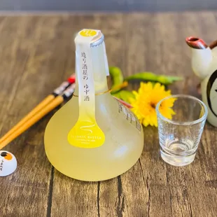 a bottle of sake and a glass of sake