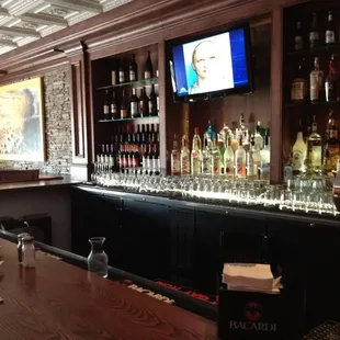 a bar with a large television