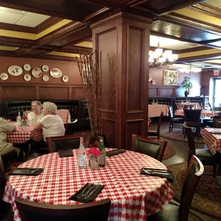people sitting at tables in a restaurant