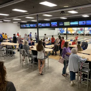 a large group of people playing bowling