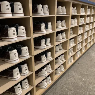 rows of shoes in a shoe store