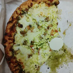 a half eaten pizza in a box