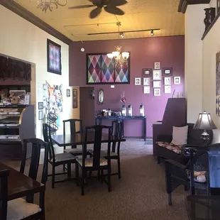 Cozy sitting area and coffee station on the far wall.