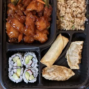 Bento box with General Tso&apos;s chicken and fried rice.