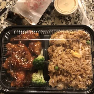 Sesame chicken with fried rice and egg roll