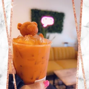 a person holding a cup of food