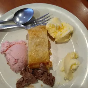 a plate of food with ice cream and dessert