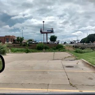 a view of a parking lot from a car window