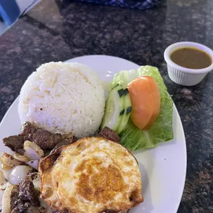 Steak and rice plate with a fried egg and salad!!