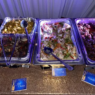 a variety of food items on a buffet table