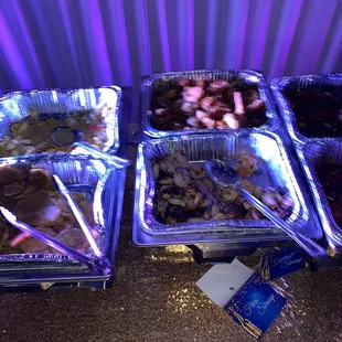 a variety of trays of food