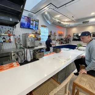 a man sitting at the counter