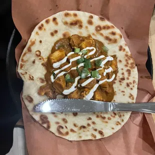 Chicken tikka taco with naan