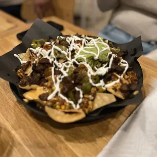 a plate of nachos on a table